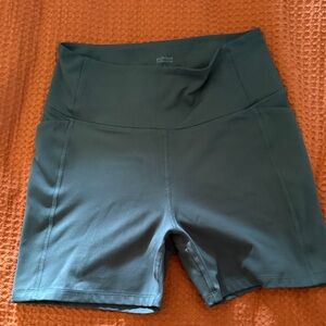 girlfriend collective forest green high waisted biker shorts with pocket